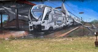 Street art silver train on track in Prague